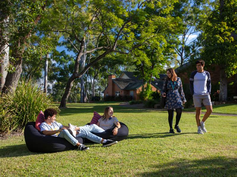 Students enjoying St John's residential College gardens at UQ in Brisbane