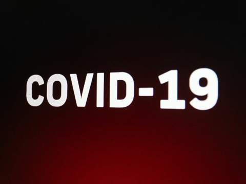 Graphic of the words COVID-19 on a dramatic background